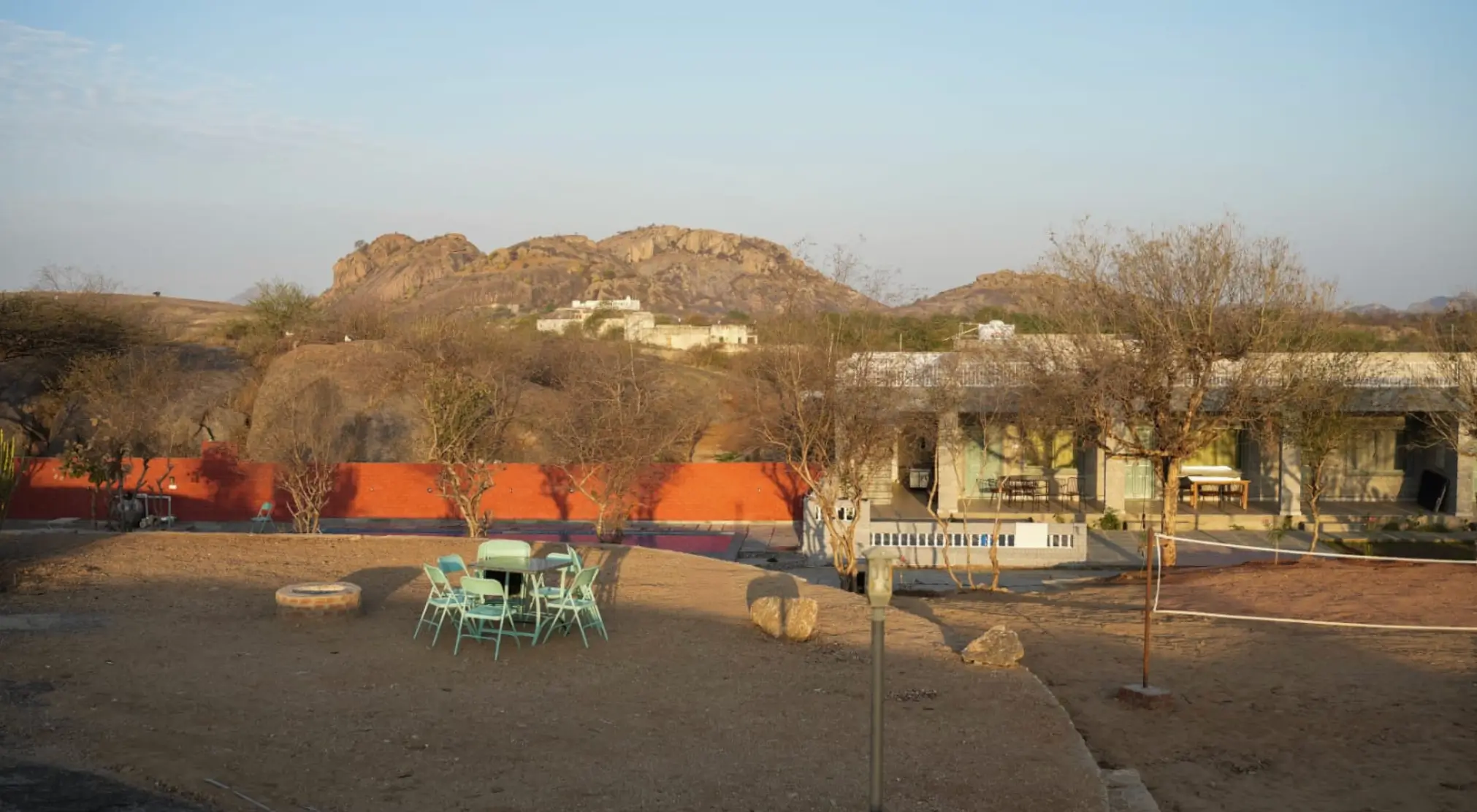 Rustic Jawai resort — pool, courtyard and granite hills, 200 m from the leopard cave zone
